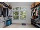 Spacious walk-in closet with custom shelving and an abundance of natural light from a large window at 100 Redfoot Run Rd, Chapel Hill, NC 27516