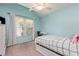 bedroom featuring blue walls, a vaulted ceiling, and a built in desk at 101 Lochmere Forest Dr, Cary, NC 27518