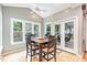 Bright breakfast nook with vaulted ceiling, large windows, and access to the outdoor deck at 101 Lochmere Forest Dr, Cary, NC 27518
