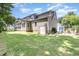 Back exterior of a home with green yard and a covered deck at 101 Lochmere Forest Dr, Cary, NC 27518