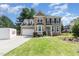 Charming two-story home with stone accents, manicured lawn, and attached two car garage at 101 Lochmere Forest Dr, Cary, NC 27518