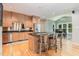 Spacious kitchen featuring island with seating and custom cabinetry, stainless steel appliances at 101 Lochmere Forest Dr, Cary, NC 27518