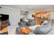Comfortable living room with open floor plan, kitchen access, and hardwood floors at 101 Lochmere Forest Dr, Cary, NC 27518