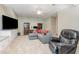 Inviting living room features cozy seating, a large TV, and built-in cabinets at 101 Lochmere Forest Dr, Cary, NC 27518