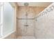 Walk in shower with updated fixtures and stone tiled walls at 101 Lochmere Forest Dr, Cary, NC 27518