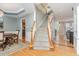 Beautiful entry with hardwood floors, staircase with wood banister and decorative dining room at 101 Lochmere Forest Dr, Cary, NC 27518