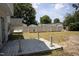 Spacious backyard with a wooden deck and a partial view of a fence surrounding the property at 103 Sara Dr, Nashville, NC 27856