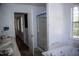 Bathroom features a shower, tub, double sink, and window at 103 Sara Dr, Nashville, NC 27856