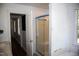 Bathroom featuring a shower stall with glass door, window, toilet and single sink vanity at 103 Sara Dr, Nashville, NC 27856
