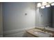 Clean bathroom featuring a sink, countertop, and mirror at 103 Sara Dr, Nashville, NC 27856