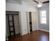 Bedroom featuring vaulted ceiling, ceiling fan, wood flooring, and bi-fold closet doors at 103 Sara Dr, Nashville, NC 27856