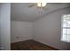 Neutral bedroom with a ceiling fan, wood-look flooring and natural light from window at 103 Sara Dr, Nashville, NC 27856
