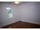 Bedroom with hardwood floors, base trim, and a window at 103 Sara Dr, Nashville, NC 27856