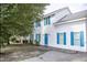 Charming two-story home featuring light-colored siding and eye-catching blue shutters at 103 Sara Dr, Nashville, NC 27856
