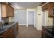 Functional kitchen with tile floors, stainless appliances, and wooden cabinets offering ample storage space at 103 Sara Dr, Nashville, NC 27856