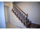 Classic staircase featuring wooden steps and a white railing at 103 Sara Dr, Nashville, NC 27856