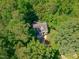 Aerial view of a home surrounded by lush trees, showcasing the privacy and natural beauty of the property at 105 Greenbriar Ct, Chapel Hill, NC 27516