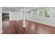 Finished basement with dark wood floors, large windows, offering ample natural light and a walk-out to the outdoors at 105 Greenbriar Ct, Chapel Hill, NC 27516