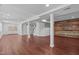 The basement is finished with dark floors and offers recessed lighting, perfect for entertaining and relaxation at 105 Greenbriar Ct, Chapel Hill, NC 27516