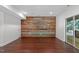 Large basement features a wall with shiplap and a door that leads to the outdoors, perfect for gatherings and entertainment at 105 Greenbriar Ct, Chapel Hill, NC 27516