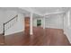 Spacious finished basement with wood flooring, stairs, and recessed lighting, offering flexible living or recreational space at 105 Greenbriar Ct, Chapel Hill, NC 27516