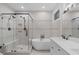 Luxurious bathroom with a glass-enclosed shower, soaking tub, and elegant vanity, creating a spa-like retreat at 105 Greenbriar Ct, Chapel Hill, NC 27516