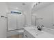 This bathroom features tile floors, shower with glass doors, and a white vanity with marble countertop at 105 Greenbriar Ct, Chapel Hill, NC 27516