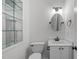 A well-lit bathroom features a modern vanity with elegant fixtures and a framed mirror on the wall above at 105 Greenbriar Ct, Chapel Hill, NC 27516