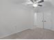 This bedroom features neutral walls, carpet flooring and includes a ceiling fan and closet at 105 Greenbriar Ct, Chapel Hill, NC 27516