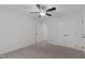 This bedroom features neutral walls, carpet flooring and includes a ceiling fan and closet at 105 Greenbriar Ct, Chapel Hill, NC 27516