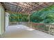 Spacious deck with a pergola and hanging lights offers a cozy outdoor space at 105 Greenbriar Ct, Chapel Hill, NC 27516
