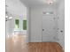 Bright foyer with hardwood floors, natural light, and seamless transitions to other rooms in the house at 105 Greenbriar Ct, Chapel Hill, NC 27516