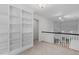 This hallway features built-in bookshelves, carpet flooring, and a white railing at 105 Greenbriar Ct, Chapel Hill, NC 27516