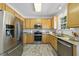 Updated kitchen boasts stainless steel appliances, granite countertops, and stylish wood-look flooring at 107 Roan Dr, Garner, NC 27529