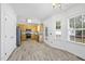 Bright kitchen with stainless steel appliances, ample cabinet space, and a cozy dining area at 107 Roan Dr, Garner, NC 27529