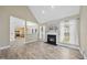 Spacious living room featuring a fireplace, lots of natural light, and stylish flooring at 107 Roan Dr, Garner, NC 27529