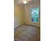 Bedroom with neutral walls and carpet, showcasing a window with natural light at 108 Shadowbrook Dr, Hillsborough, NC 27278