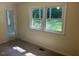 Bedroom with neutral walls and carpet, showcasing a window with natural light at 108 Shadowbrook Dr, Hillsborough, NC 27278