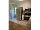 Kitchen displaying stainless steel appliances, white cabinets, and access to an exterior door for easy access at 108 Shadowbrook Dr, Hillsborough, NC 27278