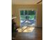 View of outdoor patio accessible from living area, overlooking fenced backyard at 108 Shadowbrook Dr, Hillsborough, NC 27278