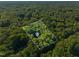 An aerial view of a home surrounded by lush trees at 10836 Wilmore Dr, Raleigh, NC 27614