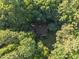 Aerial view of home completely surrounded by mature trees for ultimate privacy at 10836 Wilmore Dr, Raleigh, NC 27614