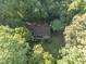 Aerial view of a home surrounded by lush trees and established landscaping at 10836 Wilmore Dr, Raleigh, NC 27614