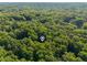 A home nestled in a forest as seen from above at 10836 Wilmore Dr, Raleigh, NC 27614