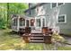 Spacious backyard featuring a multi-level deck and screened-in porch at 10836 Wilmore Dr, Raleigh, NC 27614
