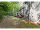 Large backyard with a deck, screened-in porch and lush greenery at 10836 Wilmore Dr, Raleigh, NC 27614