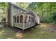 Backyard view featuring a screened-in porch and multi-level deck at 10836 Wilmore Dr, Raleigh, NC 27614
