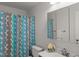 Cozy bathroom featuring a shower with tub and sink with large mirror at 10836 Wilmore Dr, Raleigh, NC 27614
