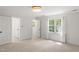 Bedroom featuring neutral carpet, large windows, closet, and recessed lighting at 10836 Wilmore Dr, Raleigh, NC 27614