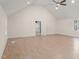 Spacious bedroom features a vaulted ceiling, ceiling fan, and light wood floors at 10836 Wilmore Dr, Raleigh, NC 27614